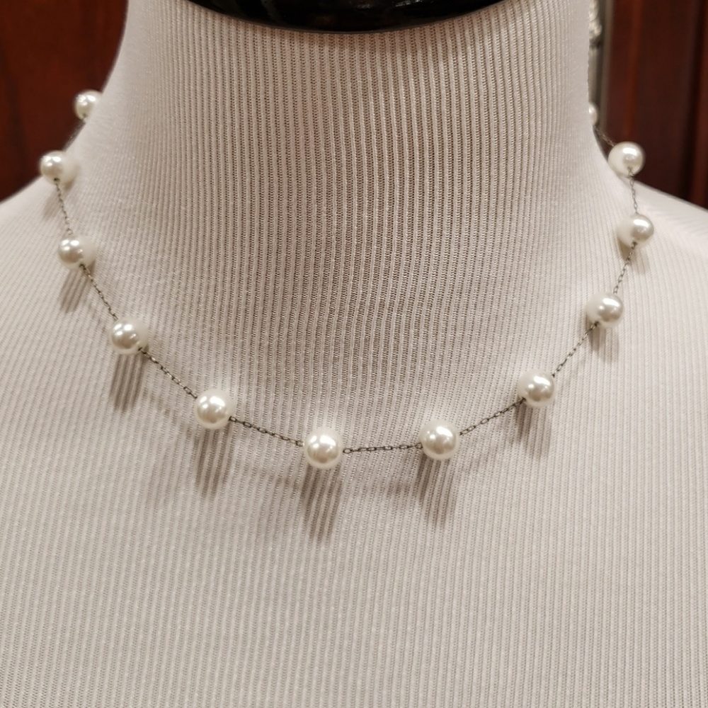 Necklace with faux pearls on very delicate chain.